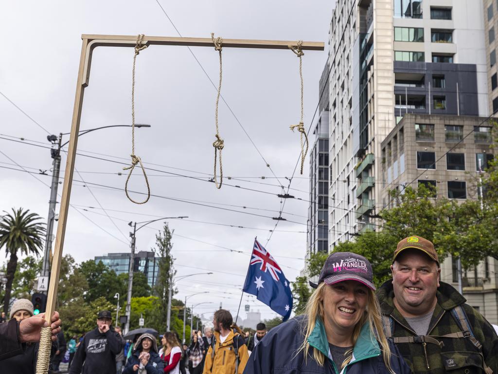 One protester appeared to be carrying a fake gallows, complete with three nooses as they marched. Picture: NCA NewsWire/Daniel Pockett