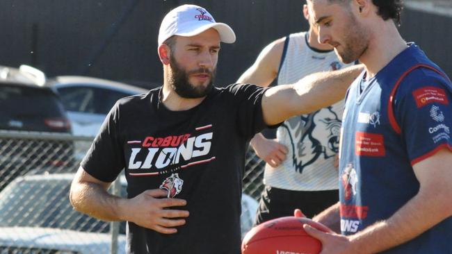 Coburg coach Andrew Sturgess talks to Luke Bunker. Picture: Daniel Atamian