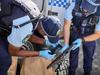 Named: Man allegedly found ‘slumped’ in car with rifle, balaclava