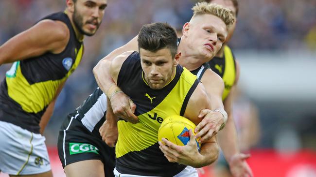 Trent Cotchin shrugs off Adam Treloar last week. Picture: Getty Images