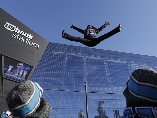 A fan jumps on a trampoline outside U.S. Bank Stadium before the NFL Super Bowl 52 football game between the Philadelphia Eagles and the New England Patriots on February 4, 2018 in Minneapolis, Minnesota. Picture: AP