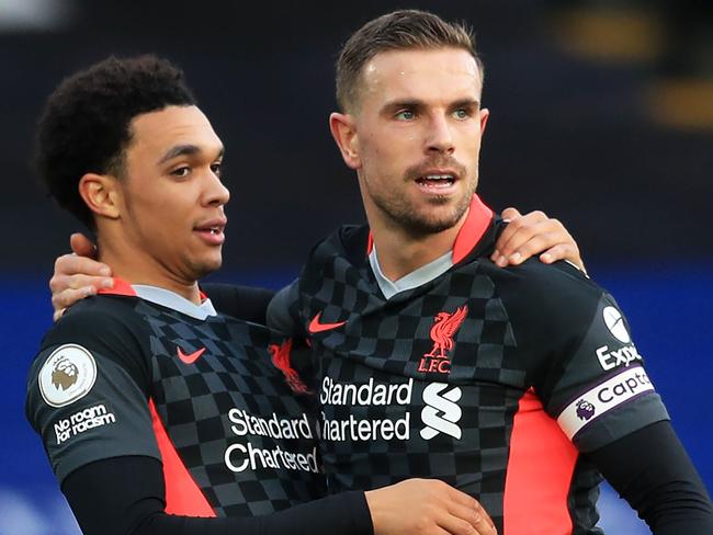 Liverpool's English midfielder Jordan Henderson (R) celebrates scoring his team's fourth goal with Liverpool's English defender Trent Alexander-Arnold (L) during the English Premier League football match between Crystal Palace and Liverpool at Selhurst Park in south London on December 19, 2020. (Photo by Adam Davy / POOL / AFP) / RESTRICTED TO EDITORIAL USE. No use with unauthorized audio, video, data, fixture lists, club/league logos or 'live' services. Online in-match use limited to 120 images. An additional 40 images may be used in extra time. No video emulation. Social media in-match use limited to 120 images. An additional 40 images may be used in extra time. No use in betting publications, games or single club/league/player publications. /