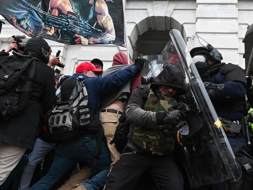 Riot police push back a crowd of supporters of US President Donald Trump after they stormed the Capitol building in Washington, DC. Picture: AFP