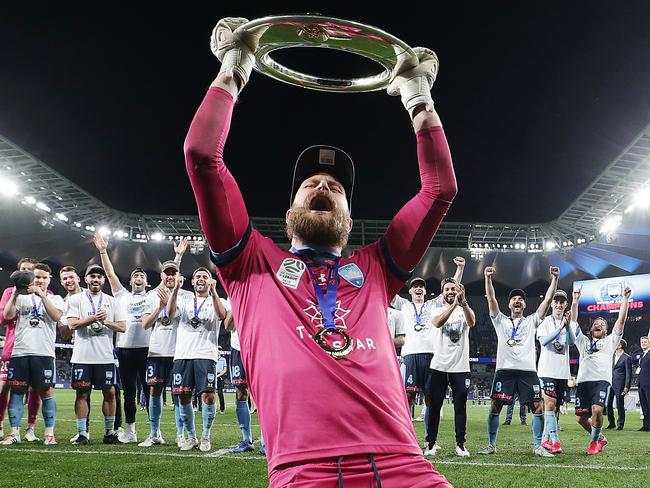 SYDNEY, AUSTRALIA - AUGUST 30: Andrew Redmayne of Sydney FC celebrates with the A-League trophy after winning the 2020 A-League Grand Final match between Sydney FC and Melbourne City at Bankwest Stadium on August 30, 2020 in Sydney, Australia. (Photo by Mark Metcalfe/Getty Images)