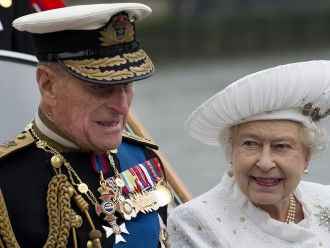 Queen Elizabeth II and Prince Philip leave from Chelsea Harbour in London, in 2012. Picture: AP