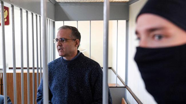 Paul Whelan, a former US Marine stands inside a defendants' cage during a hearing at a court in Moscow on August 23, 2019. (Photo by Kirill KUDRYAVTSEV / AFP)