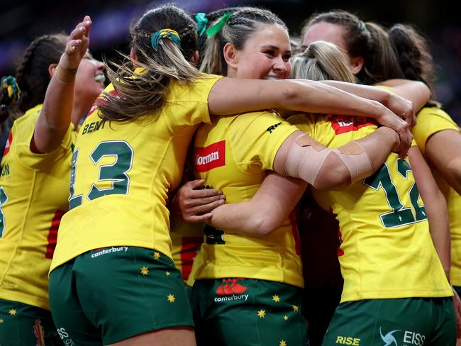 MANCHESTER, ENGLAND - NOVEMBER 19: Evania Pelite of Australia celebrates their sides tenth try with teammates during the Women's Rugby League World Cup Final match between Australia and New Zealand at Old Trafford on November 19, 2022 in Manchester, England. (Photo by Naomi Baker/Getty Images)