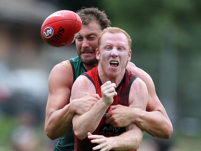 Tom Bellchambers tackles Josh Green. Pic: Michael Klein