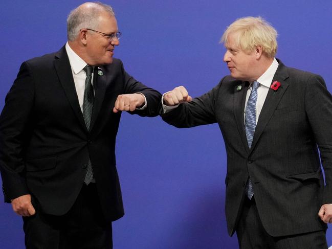 Boris Johnson greets Scott Morrison as they arrive to attend the COP26 UN Climate Change Conference in Glasgow. Picture: AFP