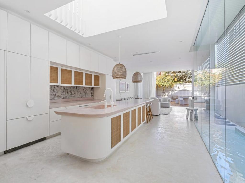 The four-bedroom, three-bathroom home features heated floors and a plush pink kitchen. Picture: realestate.com.au