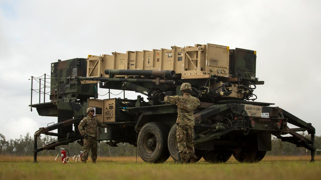 U.S. Army Sgt. Tamayo Ezekiel (left) and U.S. Army Pfc. Colby McCormick (right), Army Patriot Launching Station Enhanced Operators, raise the MIM-104 Patriot launching station Jul. 14, 2021, at Camp Growl in Queensland, Australia, during Exercise Talisman Sabre 2021. TS 21 supports the U.S. National Defense Strategy by enhancing our ability to protect the homeland and provide combat-credible forces to address the full range of potential security concerns in the Indo-Pacific. (U.S. Marine Corps photo by Lance Cpl. Alyssa Chuluda)