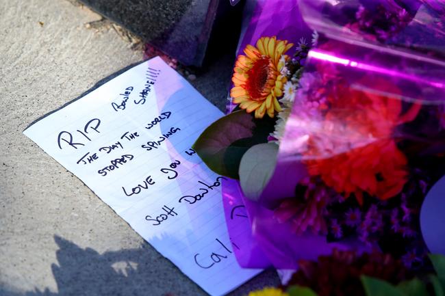 A handwritten message is seen at the base of a statue of late Australian cricket legend Shane Warne.