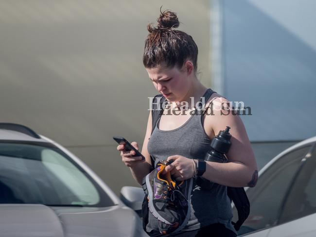 Disgraced wellness blogger Belle Gibson walks from the Reservoir Leisure Centre. Picture: Jake Nowakowski