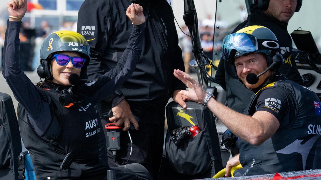 HRH Crown Princess Mary of Denmark celebrates winning the special Royal Race with Tom Slingsby after she and the Australia SailGP Team won a race against HRH Crown Prince Frederik of Denmark at the Denmark SailGP. Photo: Bob Martin for SailGP.