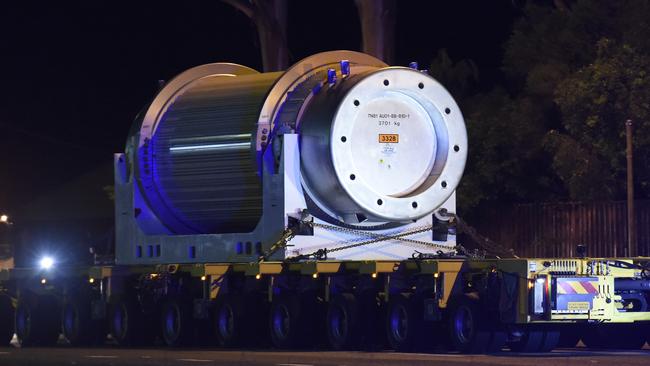 Nuclear waste is transported to Lucas Heights, southwest Sydney, in 2015. Roads along the route were shut for more than five hours, and the ­operation involved the NSW Riot Squad and other police units to contain protesters. Picture: Gordon McComiskie