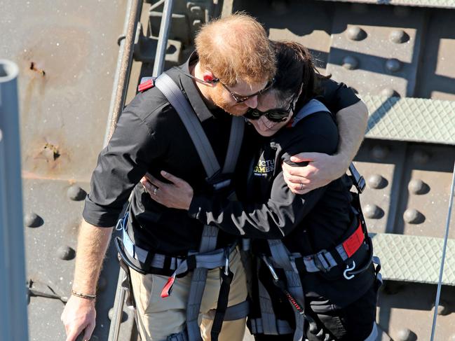 Prince Harry hugs Invictus Games ambassador Gwen Cherne. Picture: Nathan Edwards