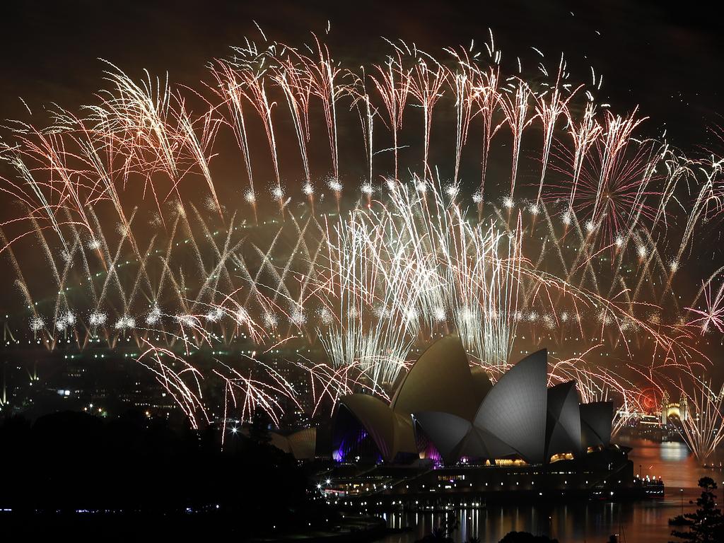 New Year's Eve 2018 - The midnight fireworks display over the Sydney Opera House and Sydney Harbour Bridge from a rooftop in Potts Point. Picture: Toby Zerna