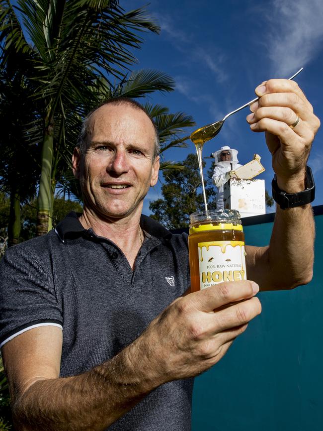 Mark Massingham with the honey his bees have produced. Picture: Jerad Williams