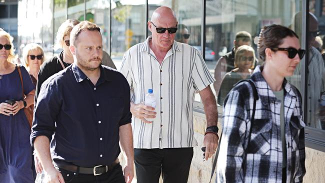 Hunter Valley bus crash survivor Graham McBride (Centre), who lost his wife Nadene and daughter Kyah in the crash arriving to the final day of sentencing of Brett Button. Picture: NewsWire/ Adam Yip