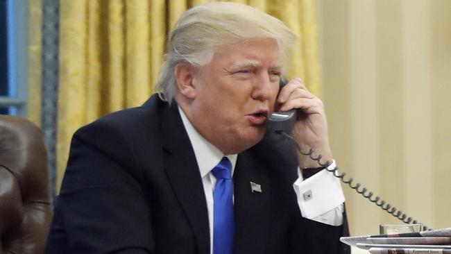 President Donald Trump speaks on the phone with Australian Prime Minister Malcolm Turnbull in the Oval Office of the White House in Washington. (Pic: AP/Alex Brandon)