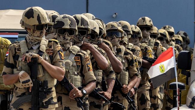 Egyptian army special forces soldiers deploy before the concrete barrier marking the border between Egypt and the Gaza Strip in Rafah. Picture: AFP