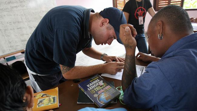 Matthew James Norman helping others prisoner in an English class at Kerobokan jail in Bali. Picture: News Corp