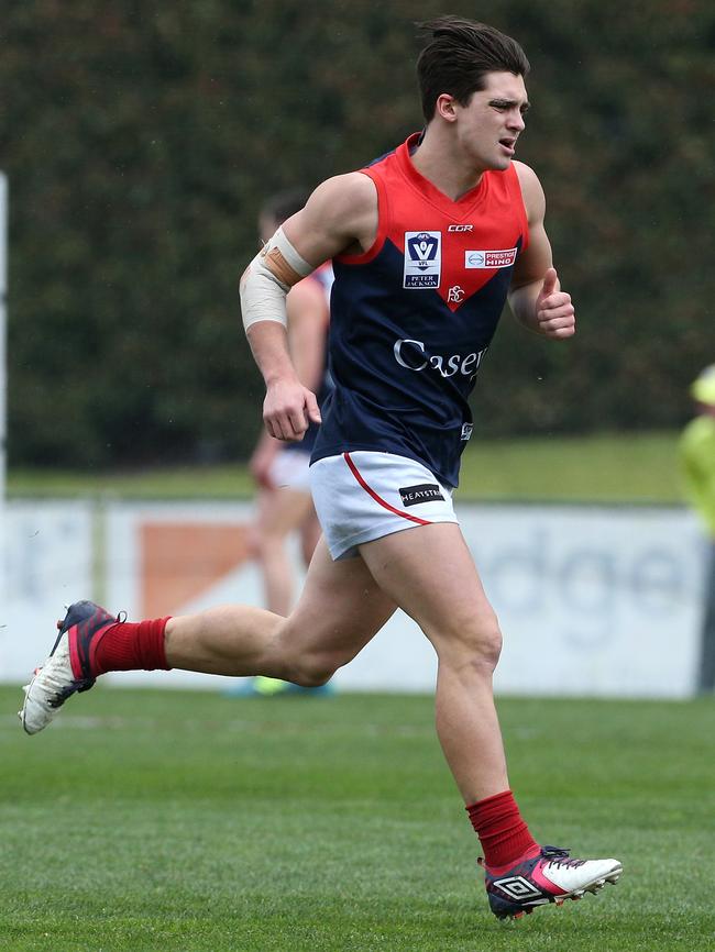 Jay Lockhart runs for the ball. Picture: Hamish Blair