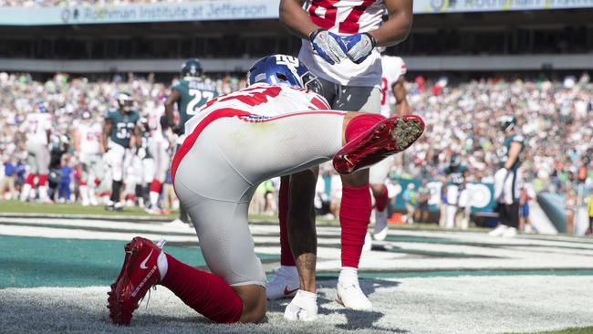 Fans celebrate after New York Giants Odell Beckham Jr. runs backward into  the end zone after he scores on a 63 yard touchdown reception in the 4th  quarter against the Philadelphia Eagles