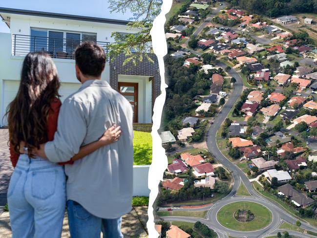 Happy Couple standing in front of their new home. They are both wearing casual clothes and embracing. Rear view. The house is contemporary with a brick facade, driveway, balcony and a green lawn. The front door is also visible.