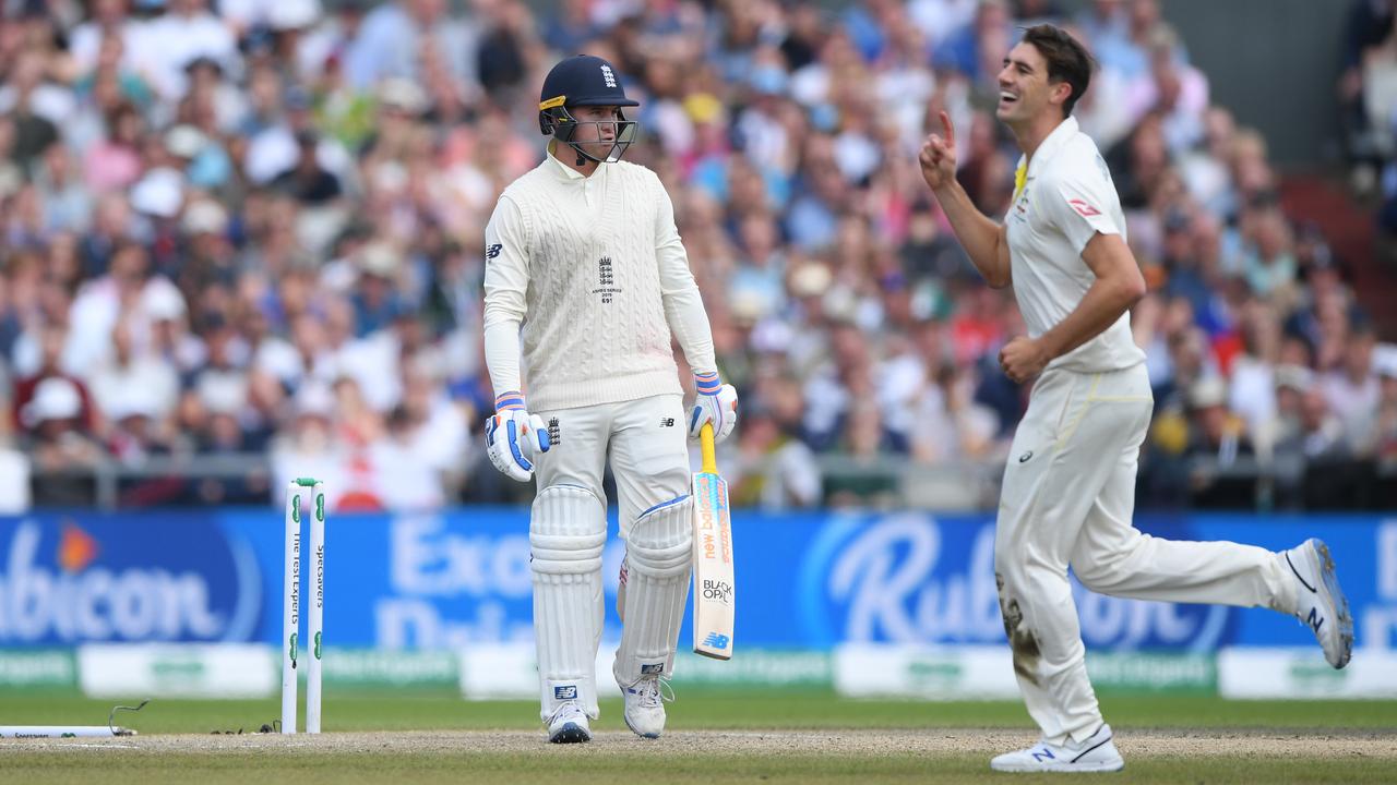 Pay Cummins reacts after knocking England batsman Jason Roy’s stump out of the ground. Picture: Stu Forster/Getty Images