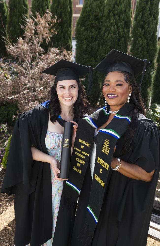 Bachelor of Nursing graduate Jacinta Gilson (left) celebrates with Master of General Nursing (Clinical) graduate Roslyn Kamara at a UniSQ graduation ceremony at The Empire, Tuesday, June 25, 2024. Picture: Kevin Farmer