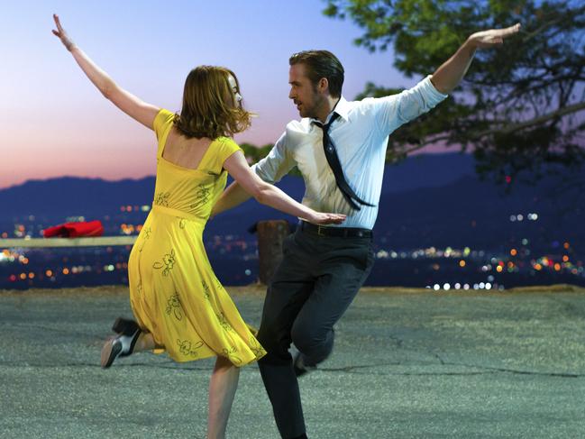 This image released by Lionsgate shows Ryan Gosling, right, and Emma Stone in a scene from, 