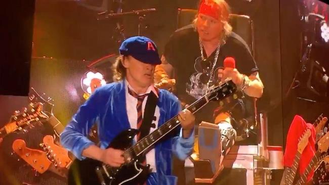 Angus Young, AC/DC guitarist, with Axl Rose of Guns N’ Roses.