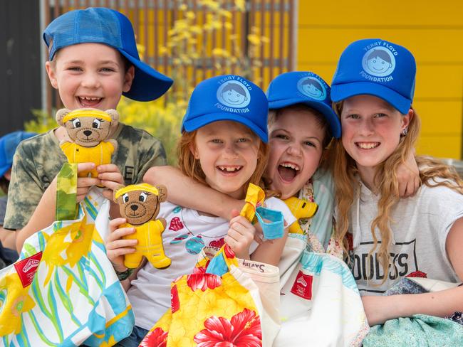 L-R Callum White, 7, Aimee West,7, Lily Cooper, 7 and Emma West, 10. Teachers and kids from the burnt out Clifton Creek Primary School  with donations from all over Aust and the world. School kids receiving the donations via Daryl Floyd of the Terry Floyd Foundation and Carlton Little Bookroom (to restock the school library). Picture: Jason Edwards