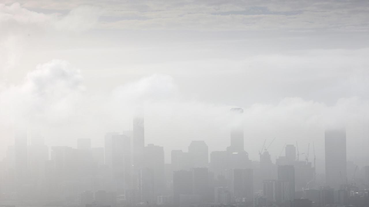 Fog hangs heavy over Brisbane obscuring the city from Mt Cootha. Picture: Steve Pohlner