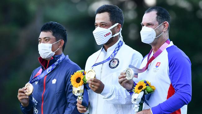 Bronze medallist, Taiwan’s Pan C T, gold medallist USA's Xander Schauffele and silver medallist Slovakia's Rory Sabbatini stand on the podium at the medal ceremony of the men’s golf individual stroke play during the Tokyo 2020 Olympic Games. Picture: Kazuhiro Nogi/AFP