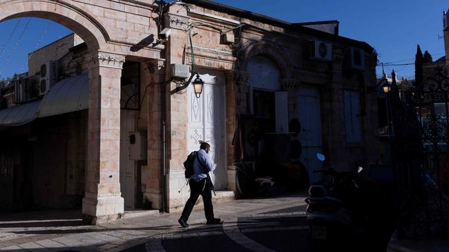 An armed Jewish man walks in Jerusalem’s Old City. Picture: AFP.