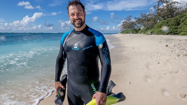 Great Barrier Reef Marine Park Authority CEO Josh Thomas looks at the reef at Lady Elliot Island. Picture: Luke Marsden.