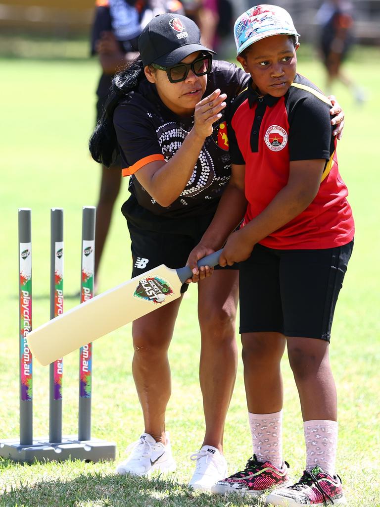 This young cricketer was open to some professional pointers during the National Indigenous Cricket Championships in Alice Springs. Picture: Chris Hyde /Cricket Australia via Getty Images/supplied
