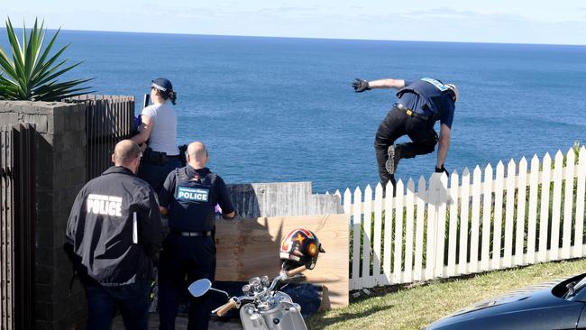 Police at the home of Kings Cross club owner John Ibrahim. He has not bee charged.