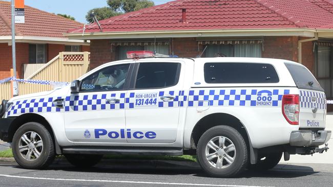 Police at the scene of a house fire in Princess Street, Corio on Monday. Picture: Alan Barber