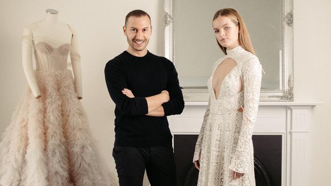 Paul Vasileff with model Eliza in a gown from a previous collection. Picture: James Elsby