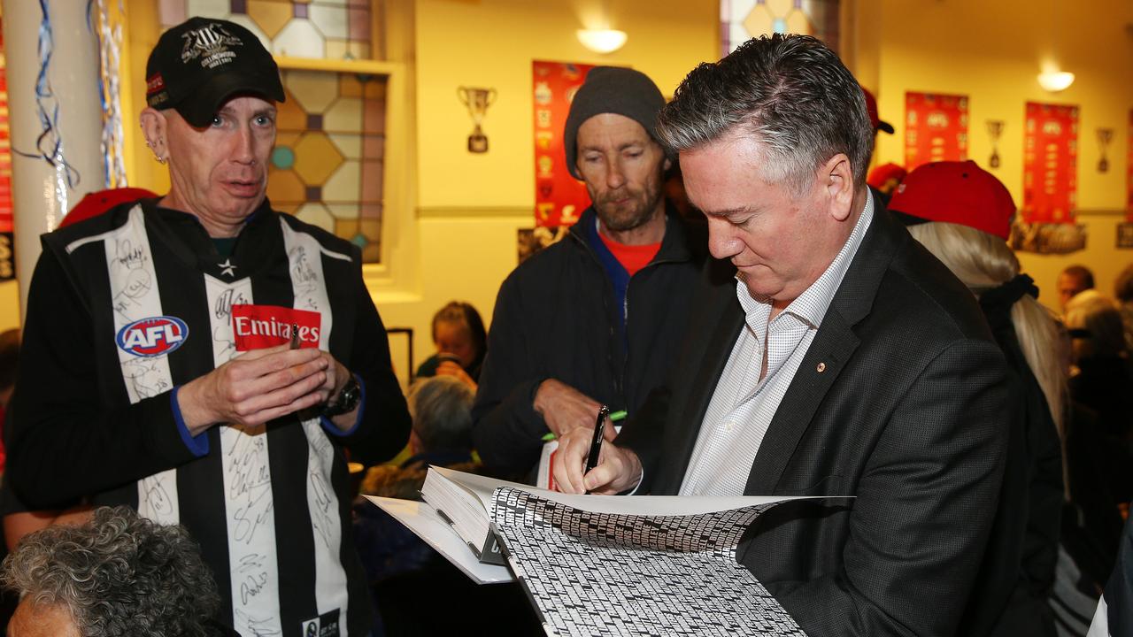 Collingwood president Eddie McGuires signs autographs as he arrives at the Salvos footy finals lunch in Bourke St headquarters. .Pic: Michael Klein