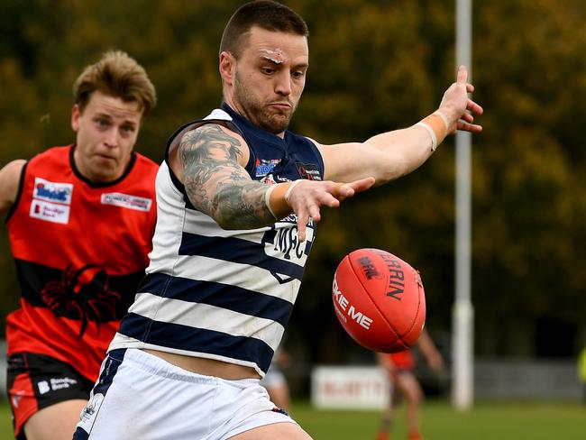 Jason Cooke of Macedon kicks during the round 16 Riddell District Football Netball League 2023 Bendigo Bank Seniors match between Romsey and Macedon at Romsey Park in Romsey, Victoria on August 5, 2023. (Photo by Josh Chadwick)