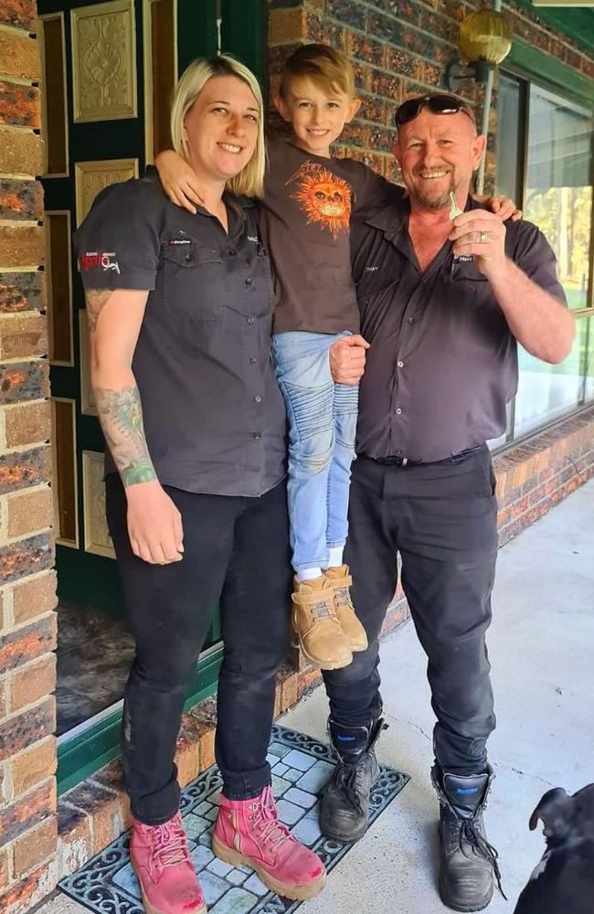 Tony Harrison from Gold Coast and Brisbane Snake Catcher with wife Brooke and son Jensen with the key to their new home in Logan. Picture: Supplied.