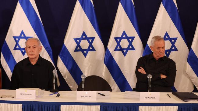 Israeli Prime Minister Benjamin Netanyahu and Benny Gantz attend a press conference in the Kirya military base in Tel Aviv on October 28, 2023.