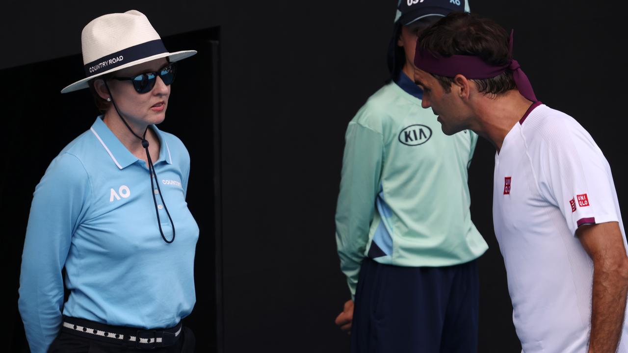 Roger Federer speaks with a lineswoman after being caught swearing in multiple languages during his Australian Open quarter-final win. Photo: Michael Klein