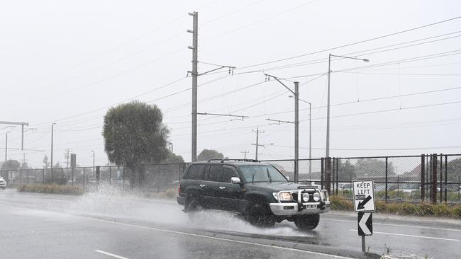 A flooded road in Chelsea, Melbourne. Picture: AAP Image/James Ross.