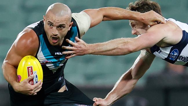 ADELAIDE, AUSTRALIA - OCTOBER 01: Sam Powell-Pepper of the Power is tackled by Jed Bews of the Cats during the 2020 AFL First Qualifying Final match between the Port Adelaide Power and the Geelong Cats at Adelaide Oval on October 01, 2020 in Adelaide, Australia. (Photo by Michael Willson/AFL Photos via Getty Images)