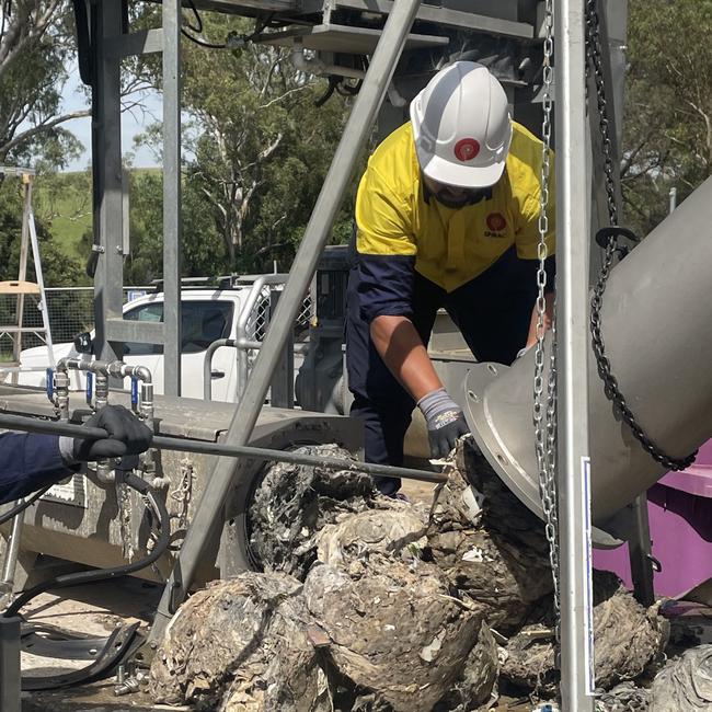 A Sydney Water worker removing ‘fatbergs’. Photo: Sydney Water